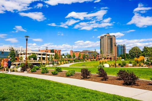 Sunny downtown Coeur d'Alene park and skyline